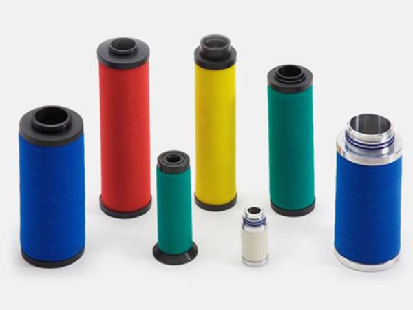 Several different types of compressed air line filter elements on white background.